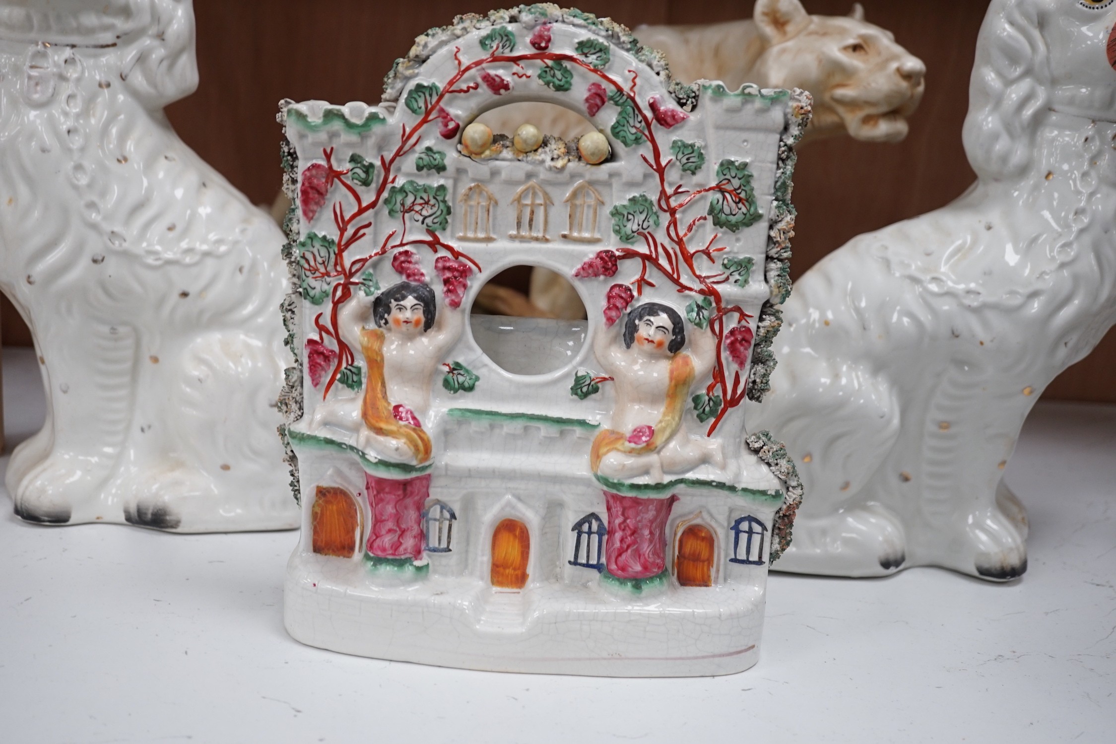 A Royal Dux tiger, a pair of Staffordshire Spaniels and a figural flat back, tiger 48 cms high